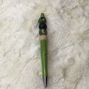 Handcrafted beaded pen. Green/black/tan/camo. Made with bpa free silicone beads